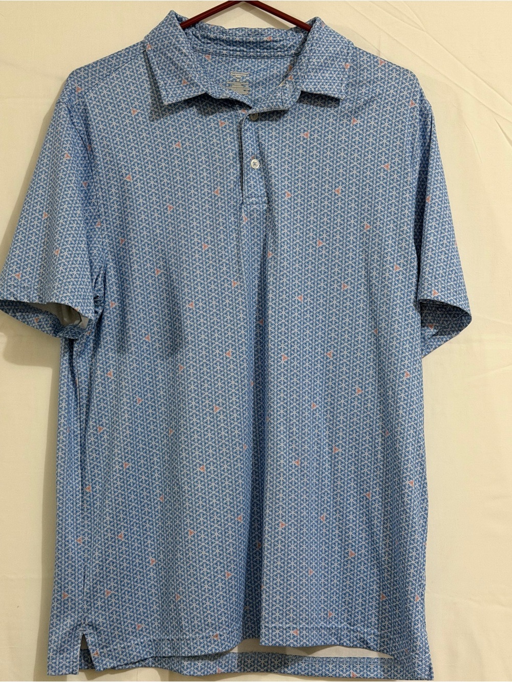 Men's Light Blue Printed Polo Shirt with Subtle Pink Accents